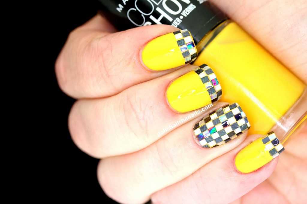 Taxi Nails with black and white square glitter over Maybelline Color Show Fiercely Tangy